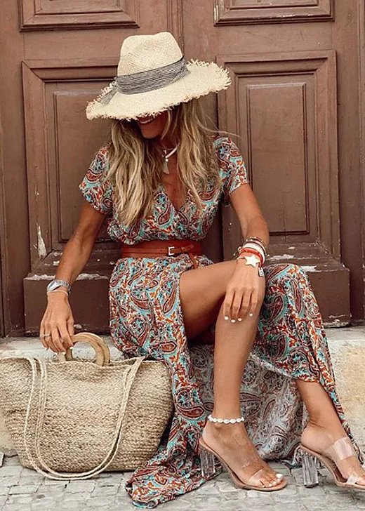 Casual women's bohemian floral maxi dress. Sleeveless V-neck with side split. Elegant summer beach fashion.