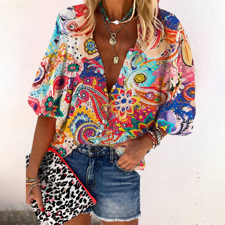 Stylish women's floral v-neck blouse. A relaxed fit, short sleeve, button-front top for bohemian summer fashion.