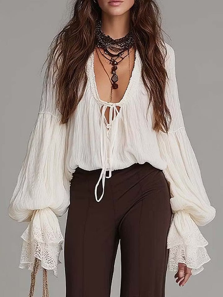 Bohemian women's two-piece set featuring a lace-up blouse & wide-leg flare pants for summer casual wear.