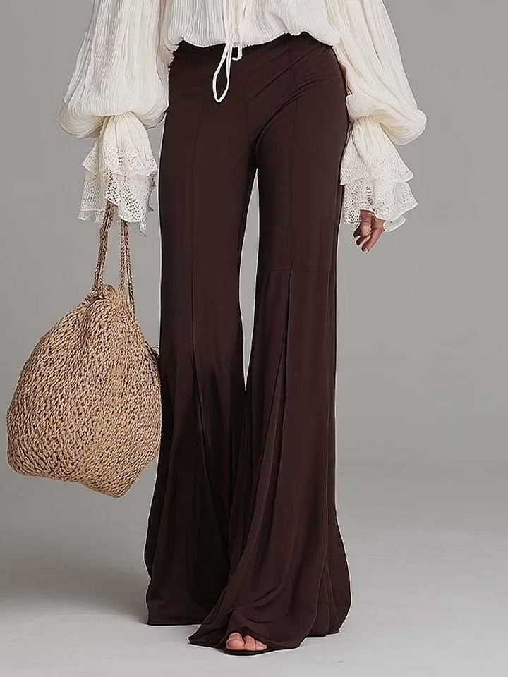 Stylish women's boho lace-up blouse and flowy wide-leg pants matching set, ideal for beach or festival.
