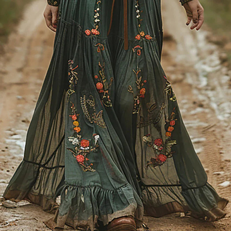 Effortless flowy maxi dress for women, featuring intricate floral embroidery and a relaxed casual summer feel.