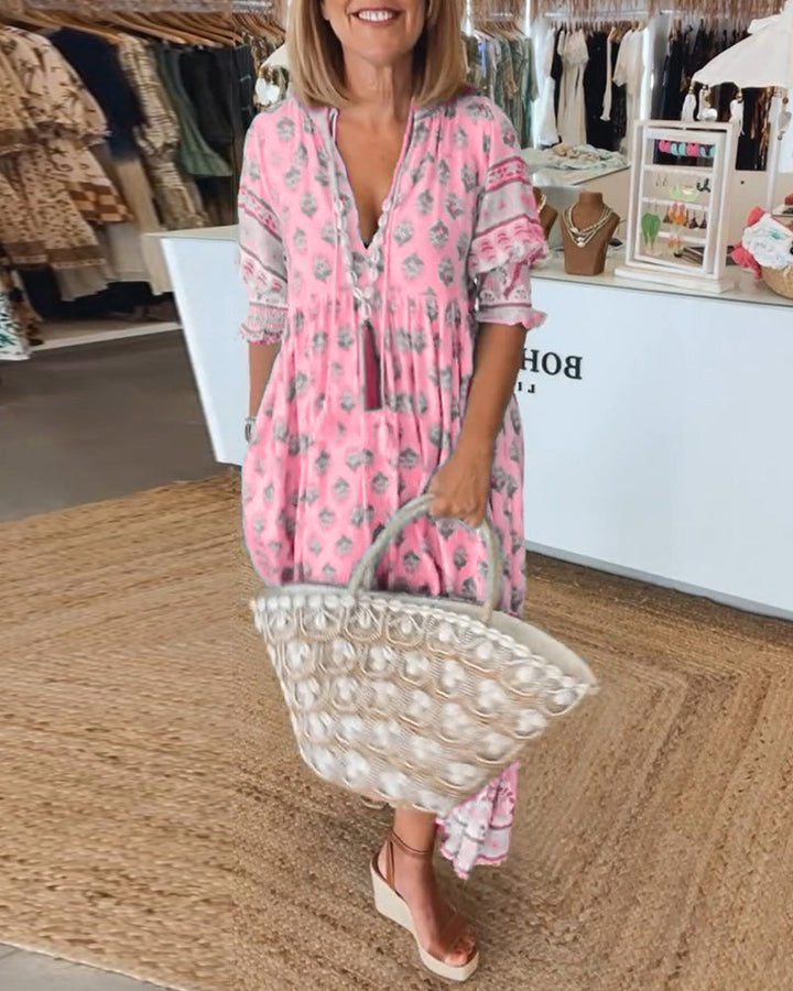 Stylish women's midi dress, bohemian design with elegant lantern sleeves & functional pockets. V-neck cut.