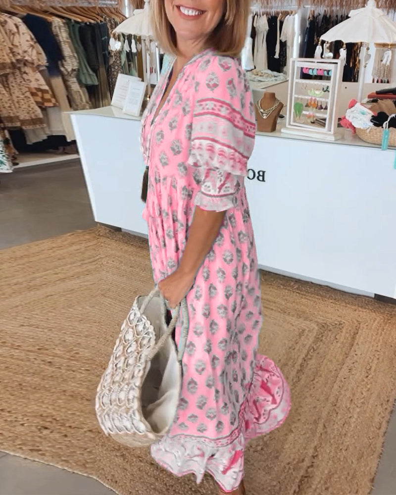 Elegant yet casual women's bohemian midi dress with V-neck, flowy fabric, lantern sleeves, & pockets.