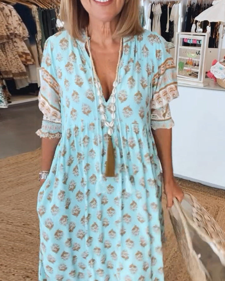 Elegant women's midi dress with chic lantern sleeves & convenient pockets. Bohemian V-neck style.