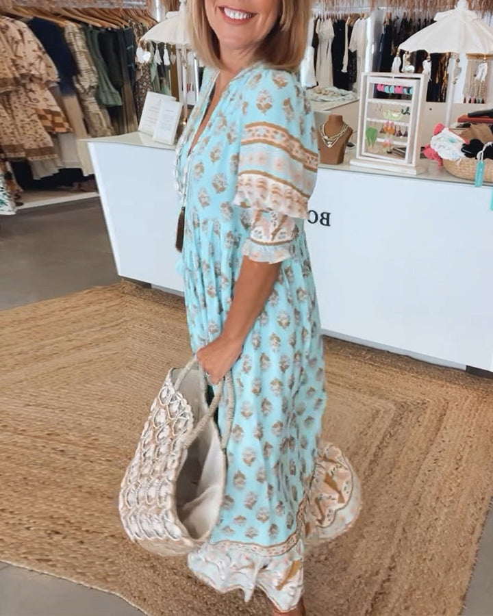 Casual summer midi dress for women, bohemian style with flowy fabric, lantern sleeves, & pockets.