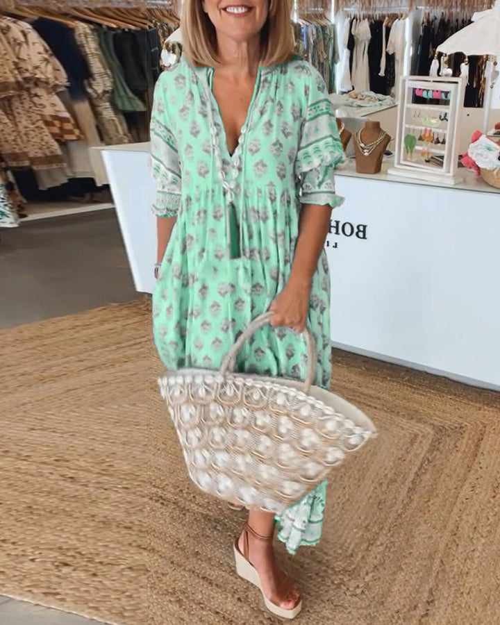Women's fashion bohemian midi dress, stylish lantern sleeves & practical pockets. Casual, elegant look.