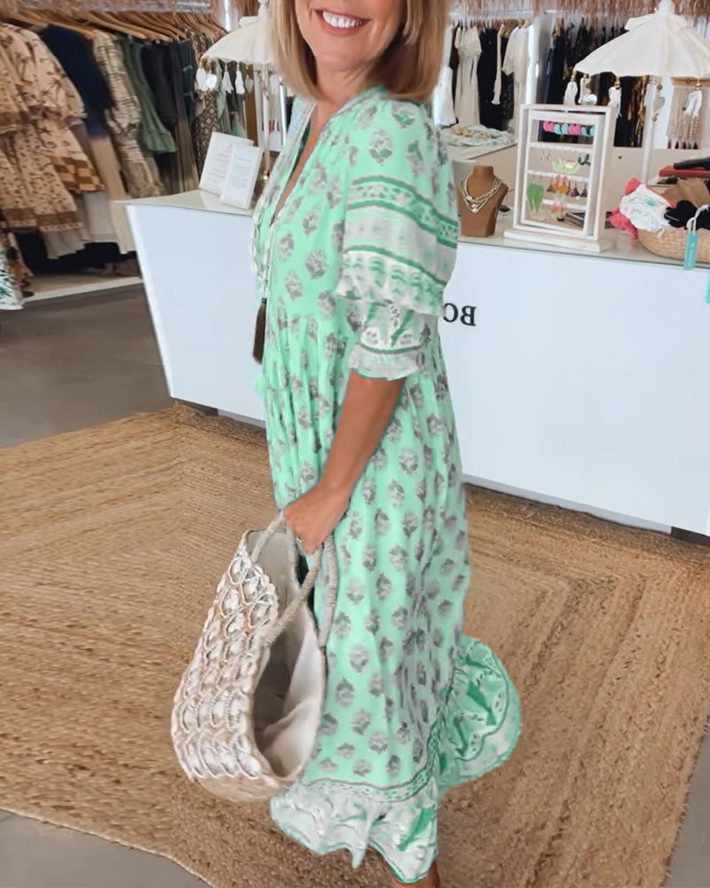 Versatile women's bohemian midi dress. Casual elegance with lantern sleeves, V-neck, & convenient pockets.