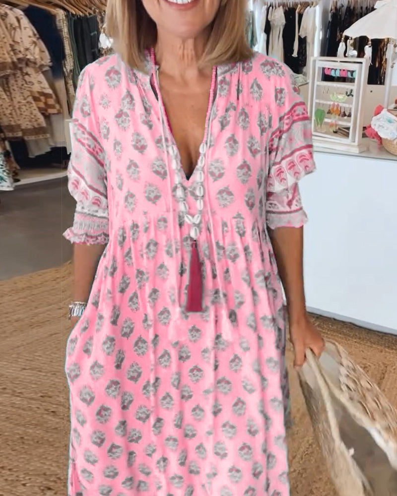Flowy summer bohemian midi dress for women, featuring chic lantern sleeves & practical side pockets.