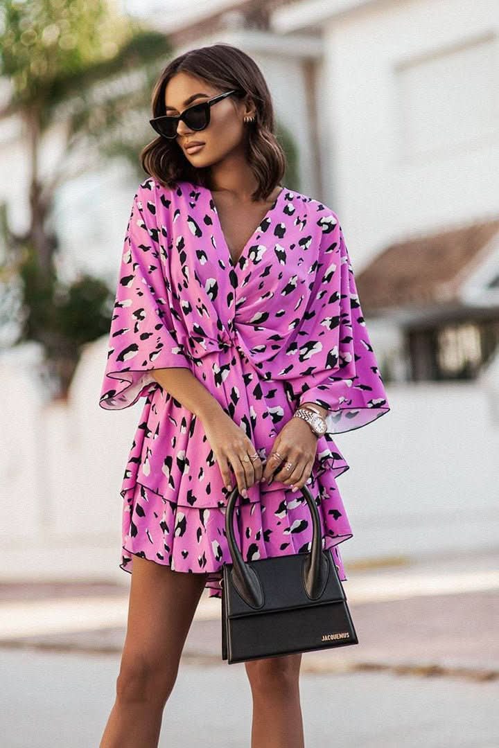 Vibrant women's bohemian off-shoulder mini dress, ideal for festivals & parties. Short, flowy, and trendy.
