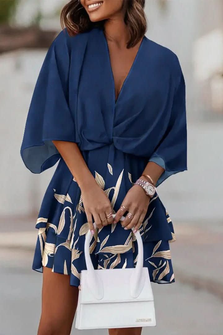 Flowy bohemian women's off-shoulder mini dress. Casual short design for a trendy summer look.