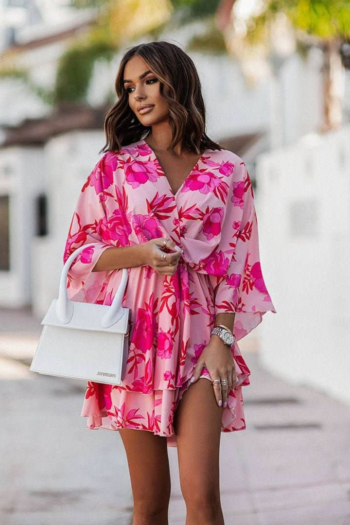 Trendy women's bohemian off-shoulder mini dress. A stylish, flowy short dress for summer and vacations.