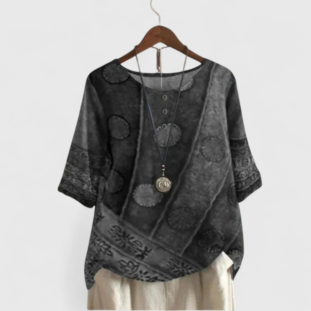 Close-up of a women's Bohemian patchwork top showcasing unique fabric patterns and a relaxed, versatile design.