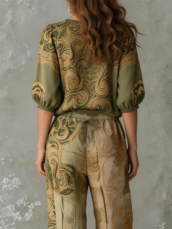Relaxed fit wide-leg pants with a vibrant bohemian print, part of a two-piece summer casual set.