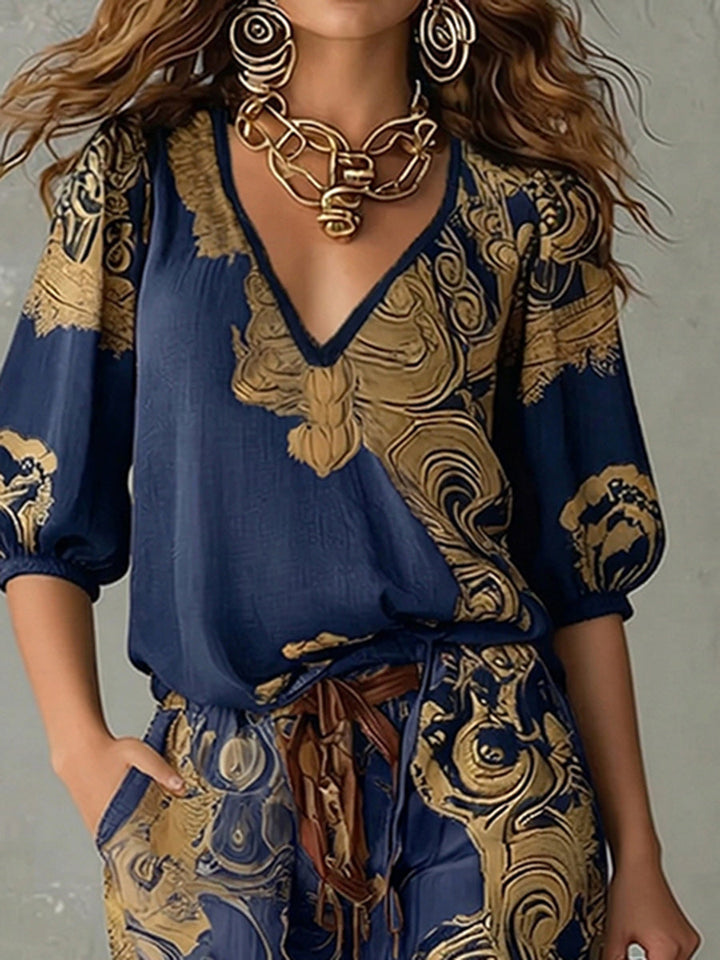 Casual women's bohemian print two-piece set featuring a v-neck top & wide-leg pants, great for summer.