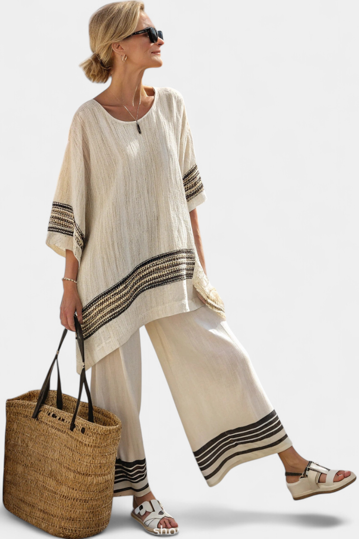 Bohemian striped women's two-piece lounge set featuring a flowy tunic top & comfortable wide-leg pants for resort style.