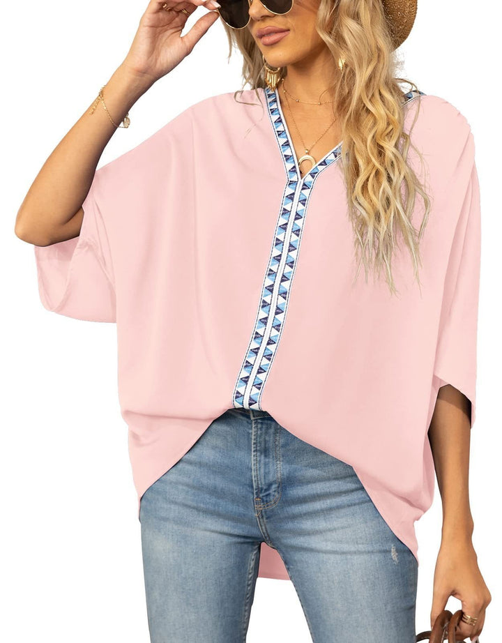 Women's bohemian tunic top with geometric V-neck trim, loose fit half sleeve.