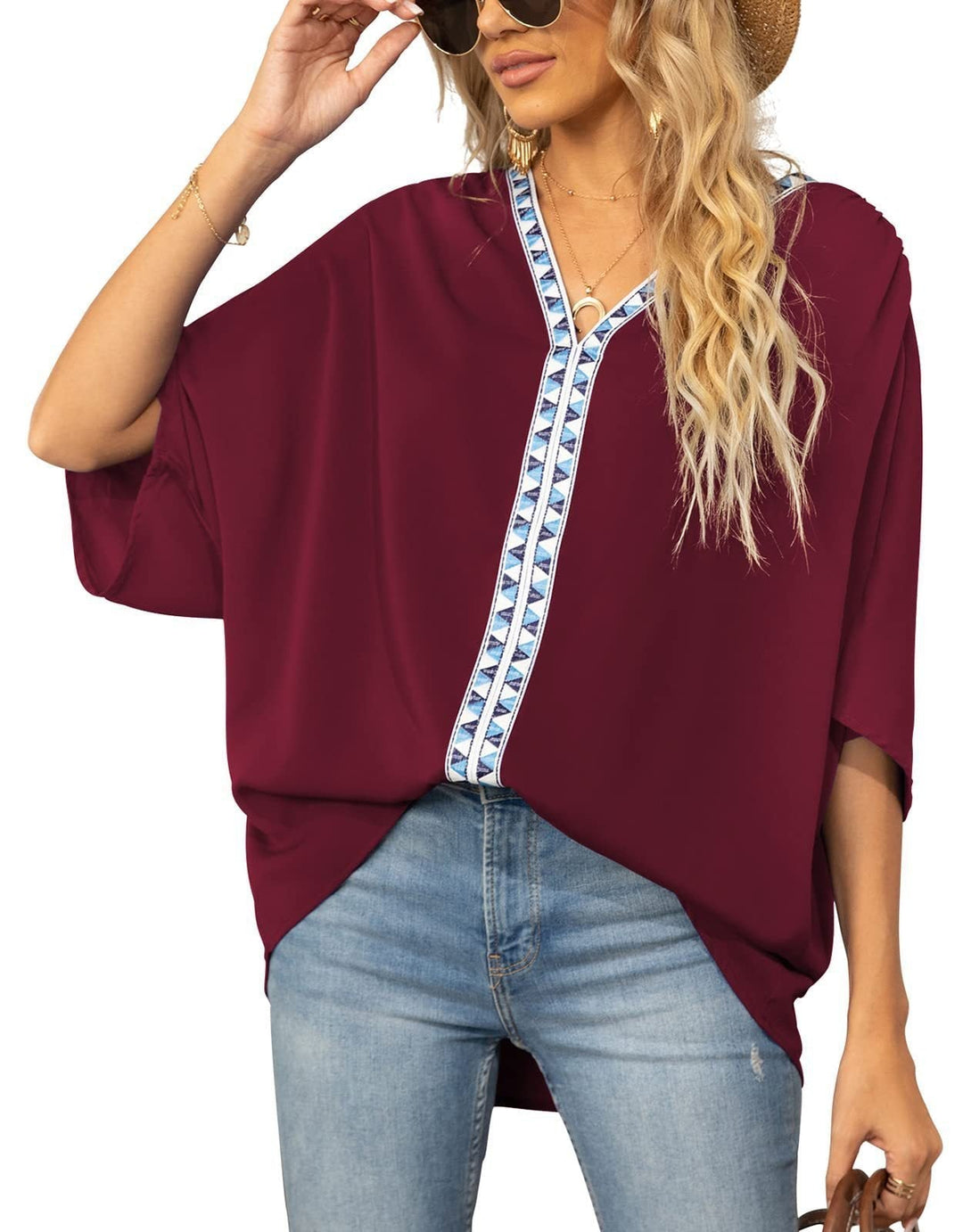 Stylish women's bohemian top, V-neck with embroidered geometric trim, perfect for summer.