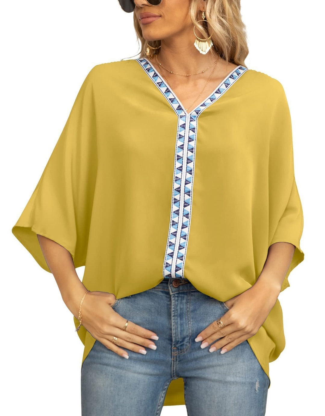 Bohemian women's V-neck top with intricate geometric trim, ideal for spring casual wear.
