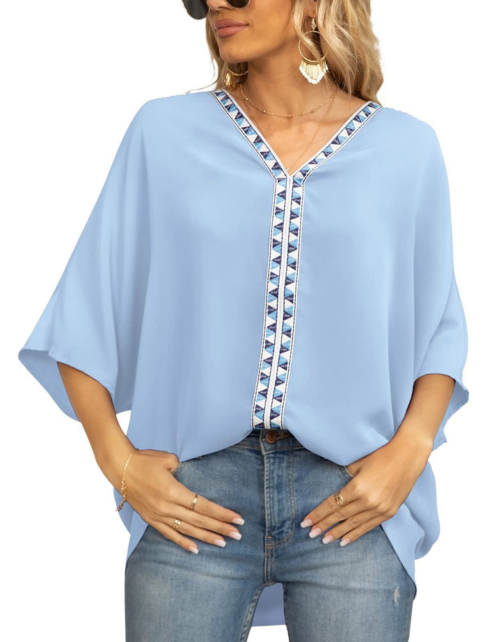 Embroidered V-neck bohemian tunic for women, comfortable loose fit and half sleeves.