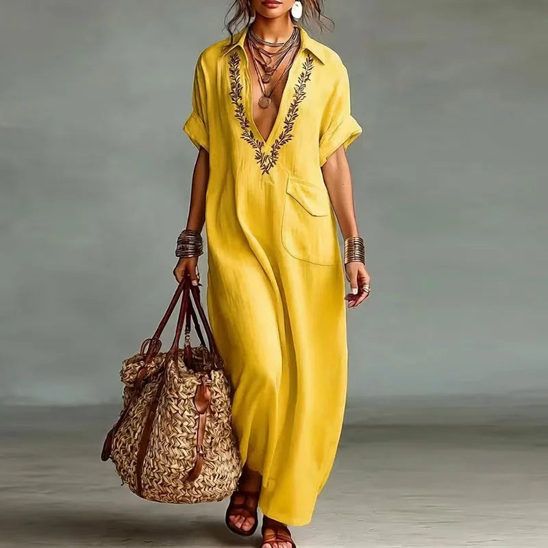 Elegant women's V-neck maxi dress, featuring a vibrant bohemian print & flowing design. Great for spring.