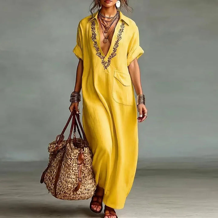 Elegant women's V-neck maxi dress, featuring a vibrant bohemian print & flowing design. Great for spring.