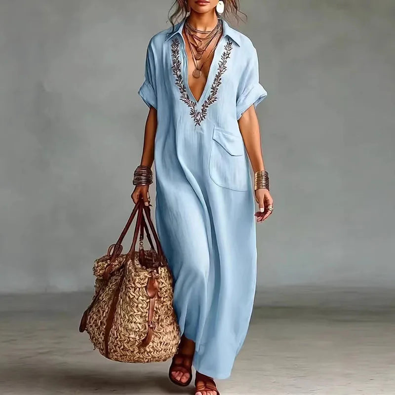 Flowing bohemian V-neck maxi dress for women. Comfortable & stylish printed design, perfect for spring/summer.