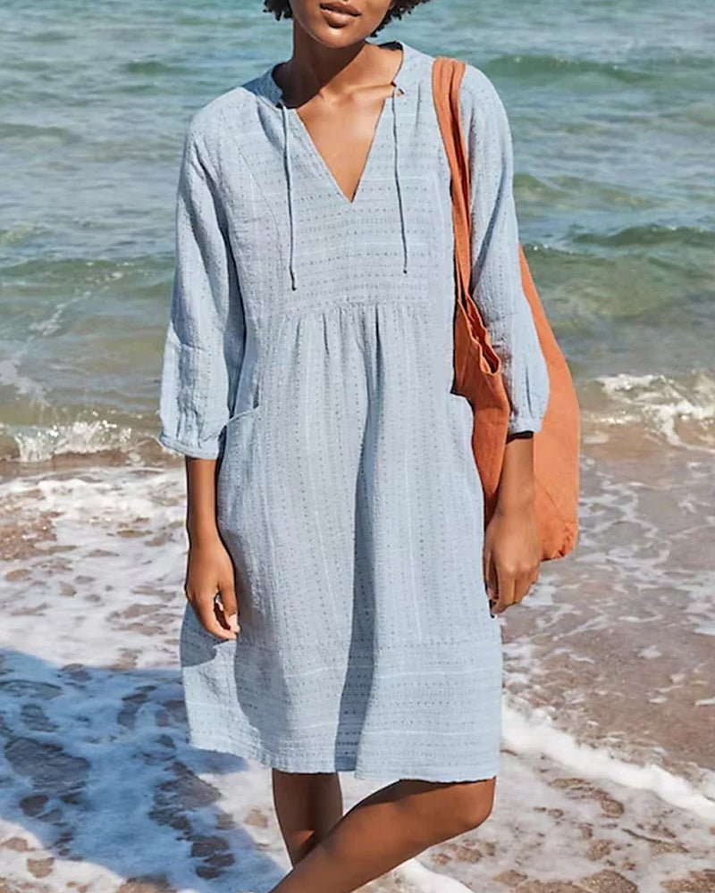 Women's bohemian V-neck midi dress for summer, featuring a relaxed, flowy fit, perfect for vacation or casual wear.