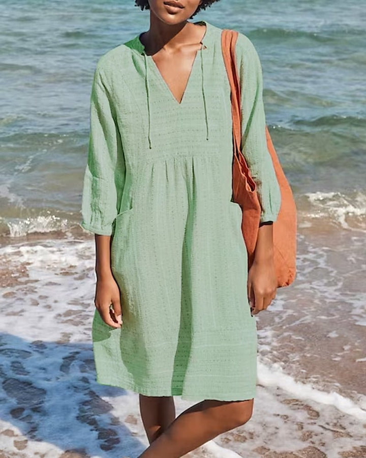 Flowy bohemian V-neck midi dress for women, designed for summer comfort, relaxed fit, and chic everyday style.