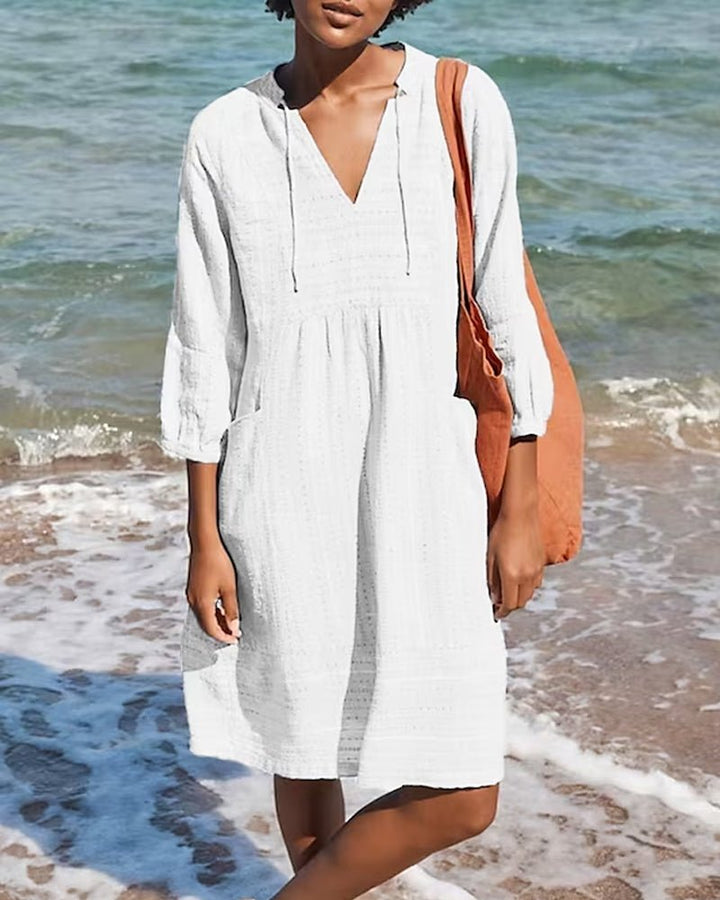 Versatile women's bohemian V-neck summer midi dress, perfect for beach vacations or relaxed everyday fashion.