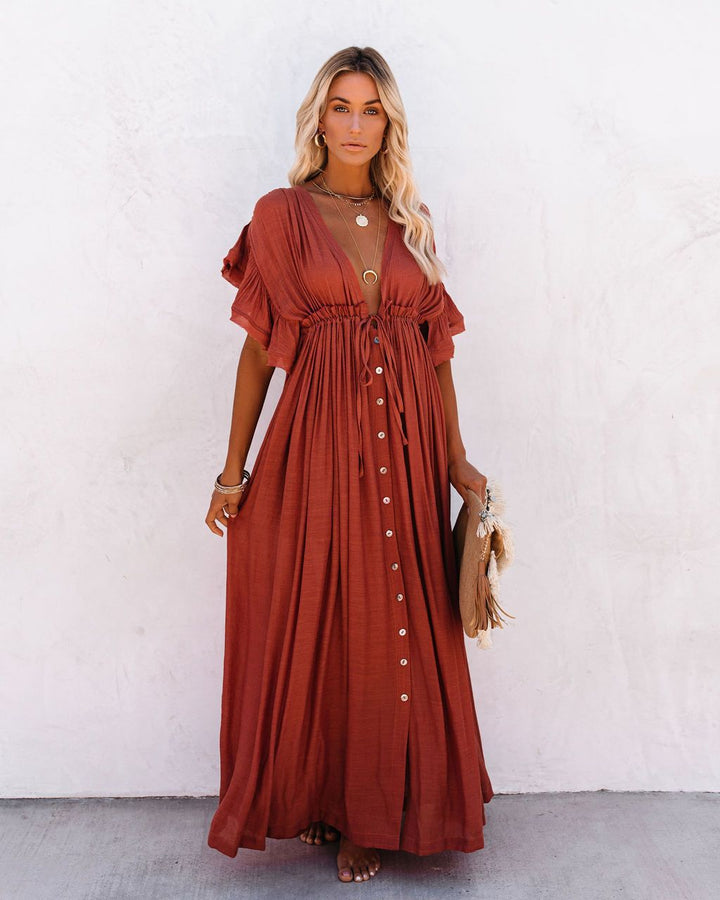 Women's vacation essential: a chic boho beach cover up with a wrap V-neck and graceful flowing silhouette.