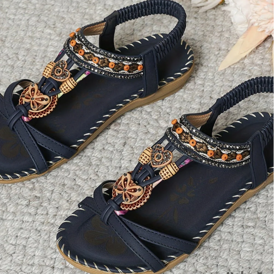 Boho-chic women's beach sandals, comfortable and stylish slip-on summer shoes for vacation.