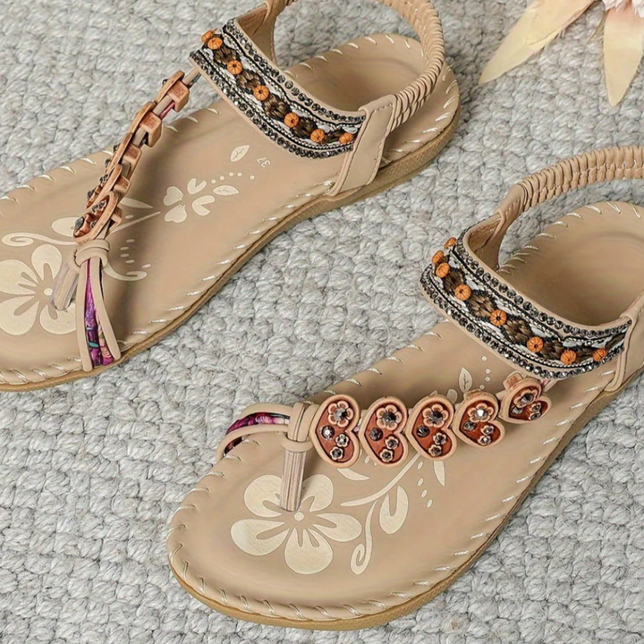 Effortless women's open-toe boho sandals. Flat design provides comfort for all-day wear.
