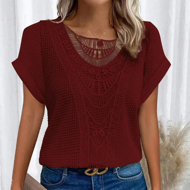 Fashionable women's short sleeve top showcasing elegant boho crochet, ideal for a relaxed, stylish outfit.
