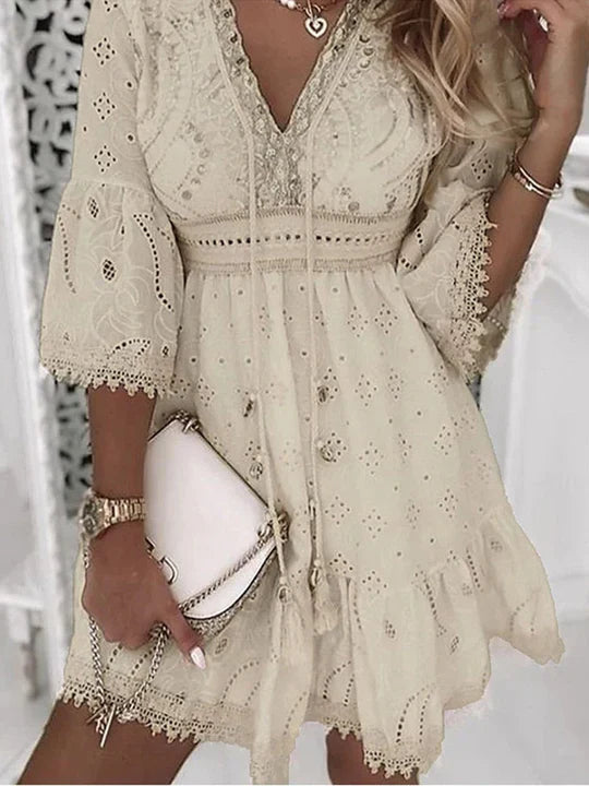 Women's boho embroidered mini dress with flare sleeves, V-neck. Perfect for summer, beach, or festival fashion.