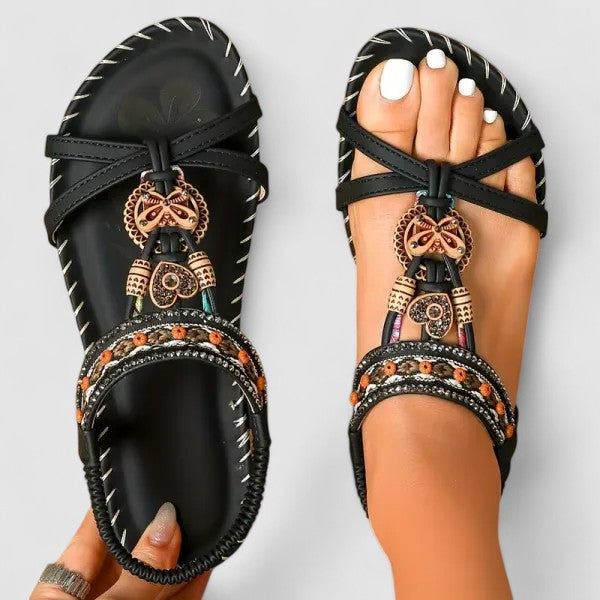 Embroidered ethnic flat sandals for women, featuring a comfortable toe-ring design and bohemian style.
