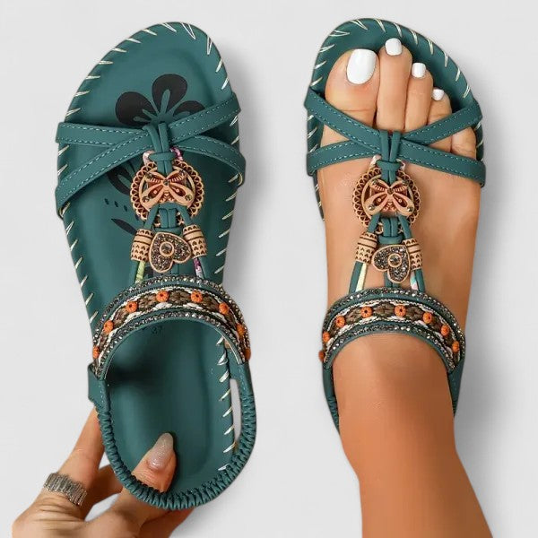 Comfortable women's flat sandals, vibrant ethnic embroidery, a stylish choice for casual summer outfits.