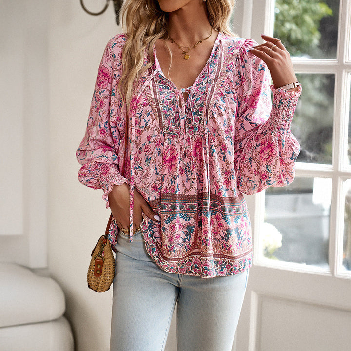 Women's boho floral blouse with puff sleeves & V-neck. Loose fit summer top, casual chic vacation wear.