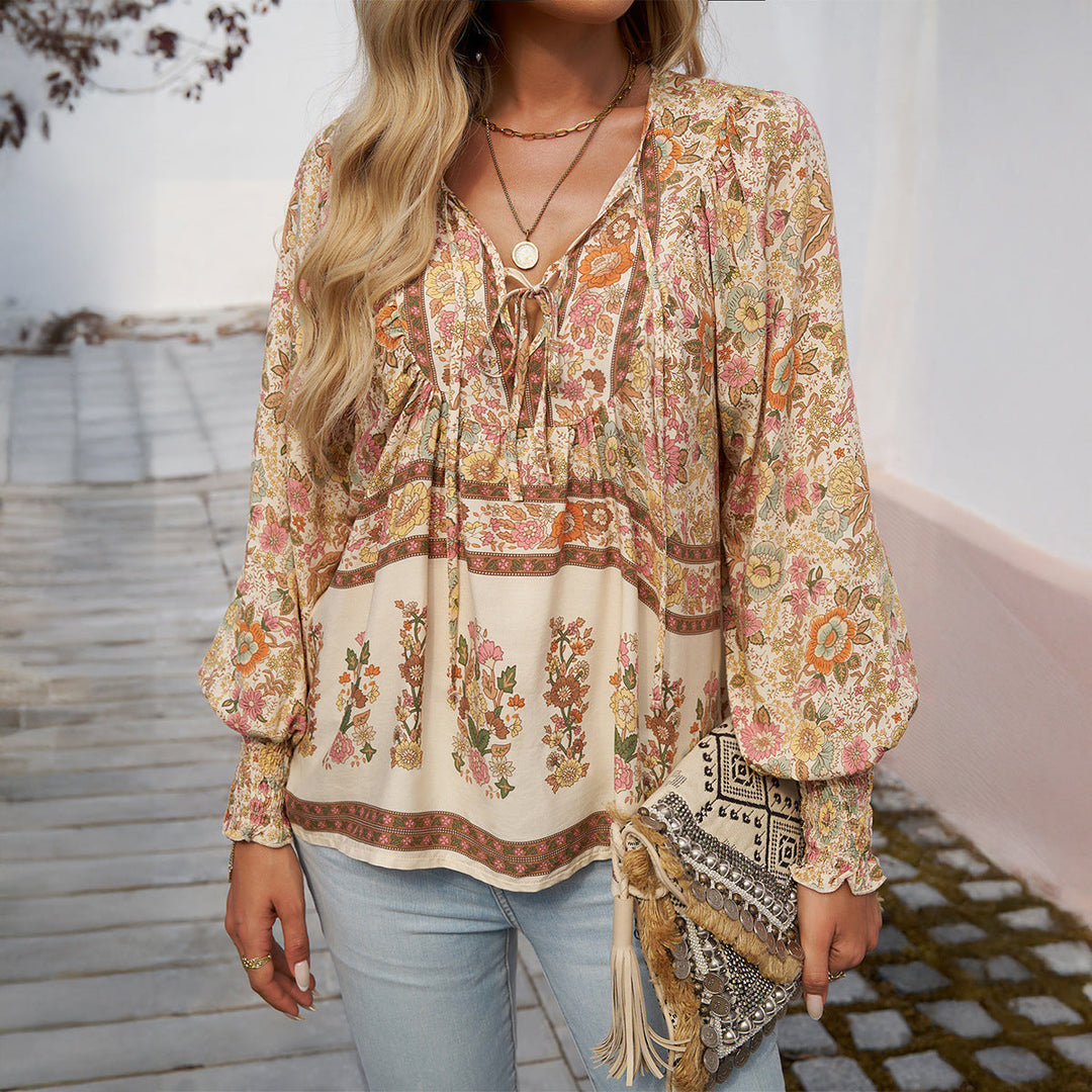 Trendy women's boho floral print blouse with puff sleeves. A casual chic V-neck top for summer vacations.