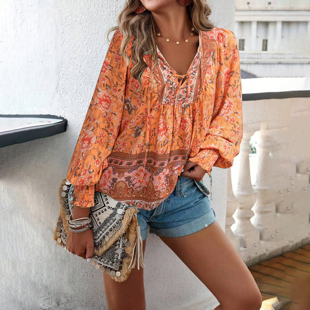 Women's boho floral blouse featuring puff sleeves & V-neck. Loose fit, perfect for casual summer style.