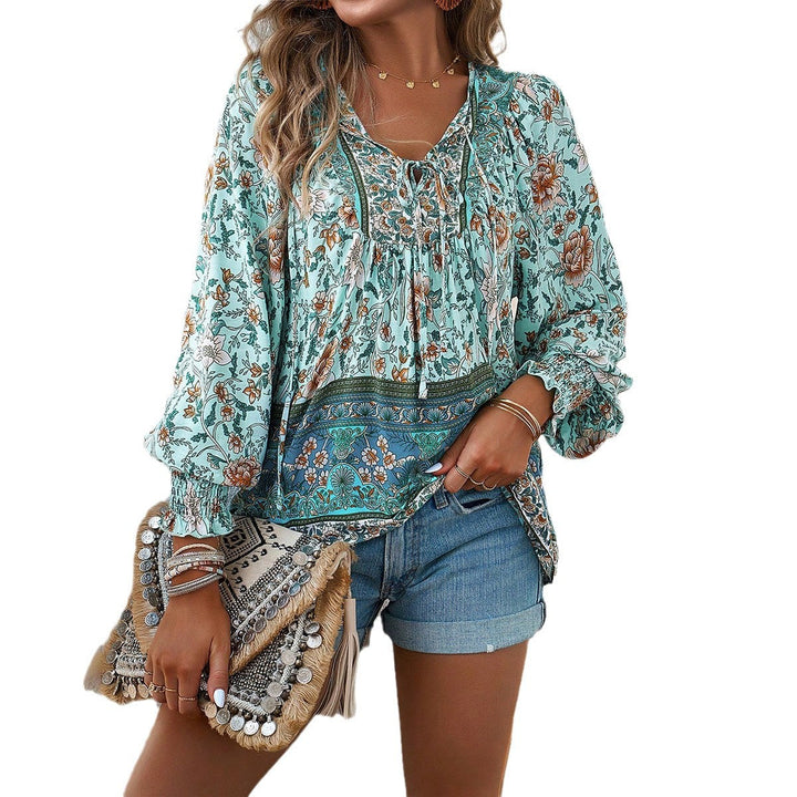 Stylish women's boho floral blouse with dramatic puff sleeves & a flattering V-neck. Ideal summer top.