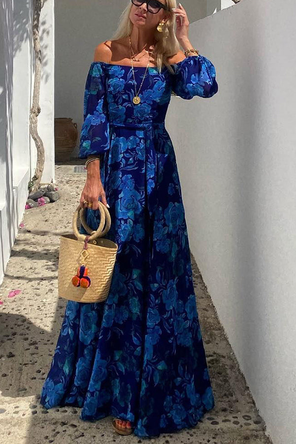 Elegant women's flowy floral off-shoulder maxi dress, ideal as a wedding guest or summer outfit.