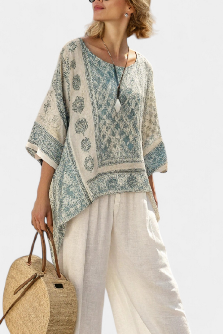 Relaxed fit multi-colored boho two-piece set for women, featuring a floral batwing blouse and wide leg pants.