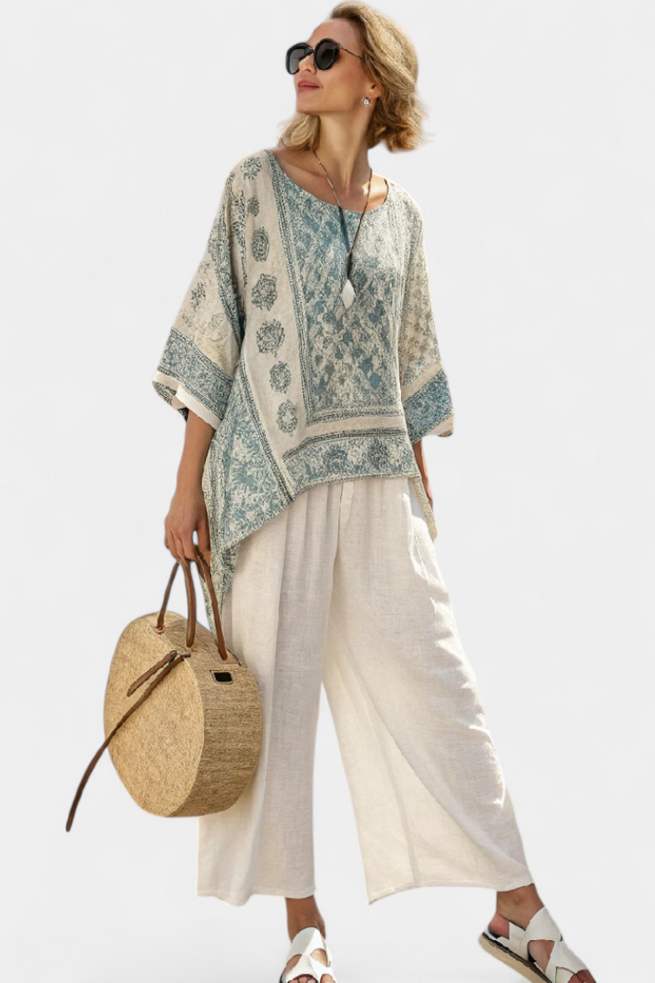 New arrival women's boho floral set with a flowing batwing blouse and wide leg pants, ideal for holiday style.