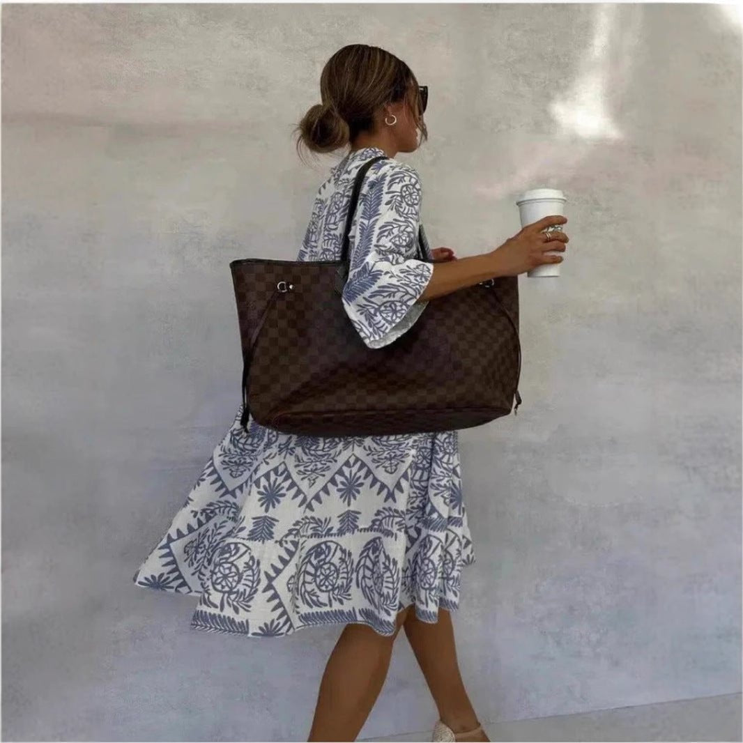 Boho style floral tiered sundress for women, loose fit with elbow sleeves, great for summer fashion.