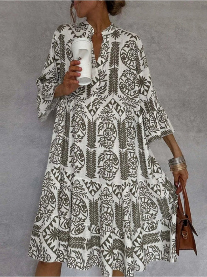 Loose fit women's floral sundress with elbow sleeves & tiered skirt, a comfortable boho summer dress.