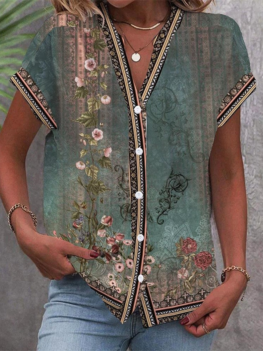 Women's boho floral V-neck blouse, relaxed fit with short sleeves. A stylish bohemian spring/summer top.
