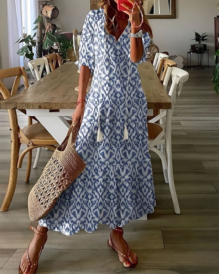 Women's boho flowy maxi dress with adjustable straps, perfect for summer casual wear or beach vacation.