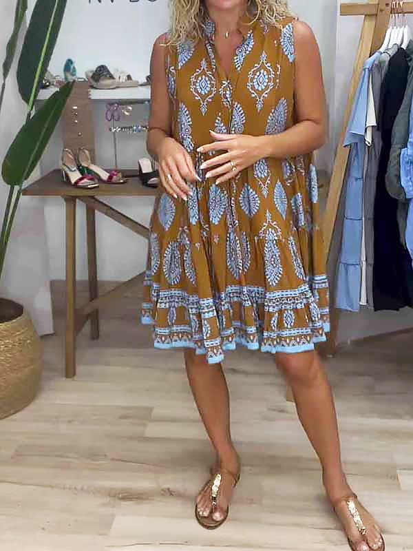 Women's boho medallion print smock mini dress with ruffle hem. Perfect sleeveless summer or vacation outfit.