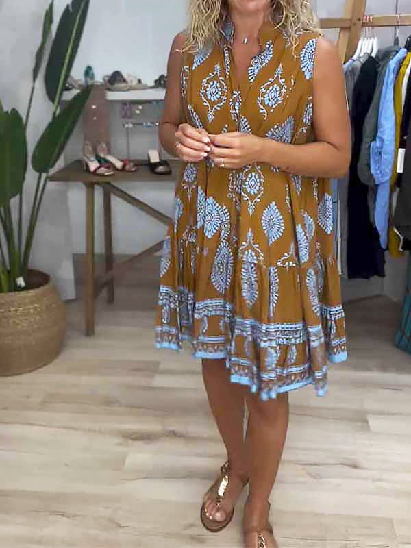 Casual women's bohemian mini dress, sleeveless, with a vibrant medallion print and stylish ruffle hem design.