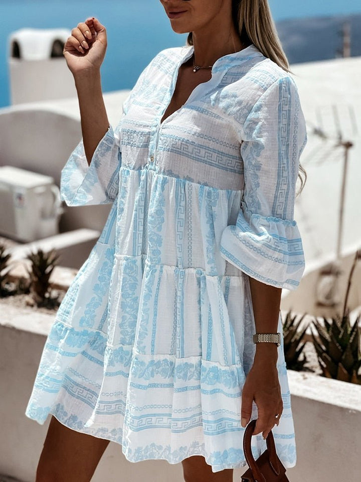 Casual women's mini dress, tiered flare sleeves, bohemian chic for vacations and spring fashion.
